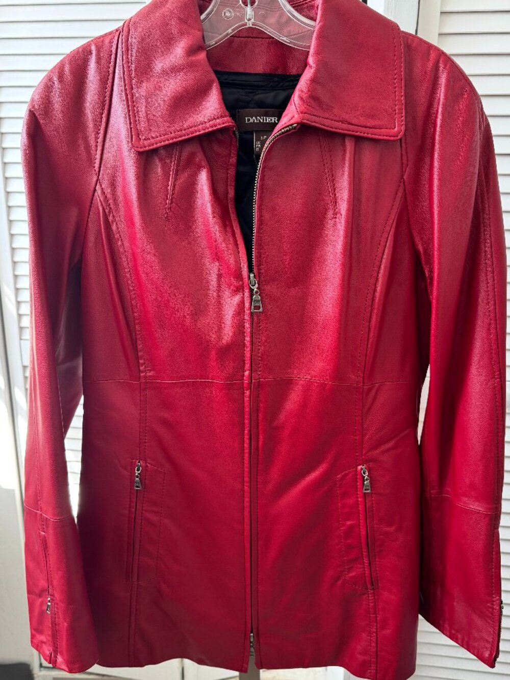 Vibrant red leather jacket by Danier
